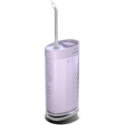 Fioletowy, bezprzewodowy irygator Philips Sonicare Compact Flosser 1000 HX3333/23 z przezroczystą dyszą na górze. Na urządzeniu widoczne są przyciski oraz napisy: "pulse", "clean", "sensitive", a także logo "Philips Sonicare".