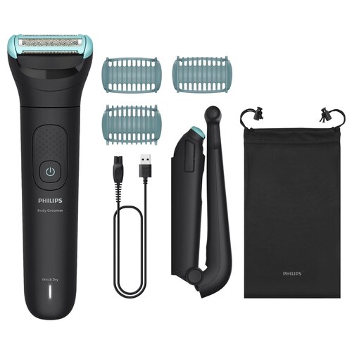 Na zdjęciu znajduje się trymer PHILIPS Body Groomer Seria 5000 BG5480/15 wraz z trzema nasadkami, kablem USB, uchwytem do przedłużenia oraz czarnym woreczkiem z logo PHILIPS. Na trymerze widoczny jest przycisk zasilania oraz napisy "PHILIPS", "Body Groome