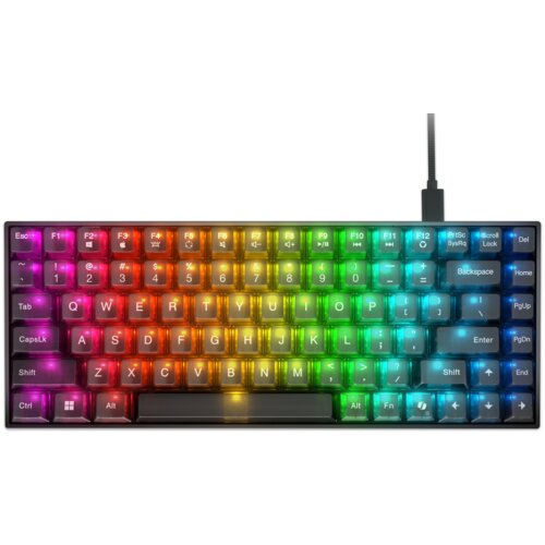 Na zdjęciu znajduje się klawiatura z podświetleniem RGB, z widocznymi klawiszami oznaczonymi literami, cyframi oraz funkcjami specjalnymi. Klawiatura jest podłączona kablem, a na klawiszach widoczne są różnokolorowe światła, tworzące efekt tęczy.