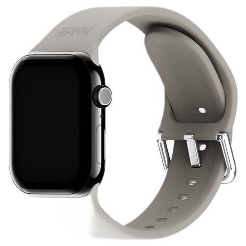 Beżowy pasek silikonowy do zegarka Apple Watch z widocznym zapięciem i otworami regulacyjnymi. Na pasku znajduje się logo "Holdit".