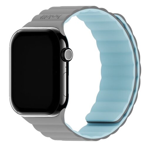 Szaro-niebieski pasek silikonowy do zegarka Apple Watch, widoczny z boku, z logo "holdit" na powierzchni. Pasek ma falistą strukturę i jest przymocowany do zegarka z ciemnym ekranem.