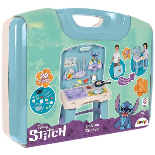 Na zdjęciu znajduje się opakowanie zabawki kuchni z motywem Disney Stitch, zawierające ilustracje kuchni z akcesoriami oraz postacią Stitcha. Widoczny jest napis "20 Accessories", "Cuisine Kitchen", "30" oraz logo Smoby.