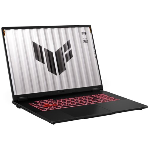 Czarny laptop z czerwonym podświetleniem klawiatury, na ekranie widoczny jest wzór złożony z ciemnych prostokątów oraz tekst "TUF" i inne drobne napisy. Obudowa ma nowoczesny design, a ekran jest otwarty pod kątem.