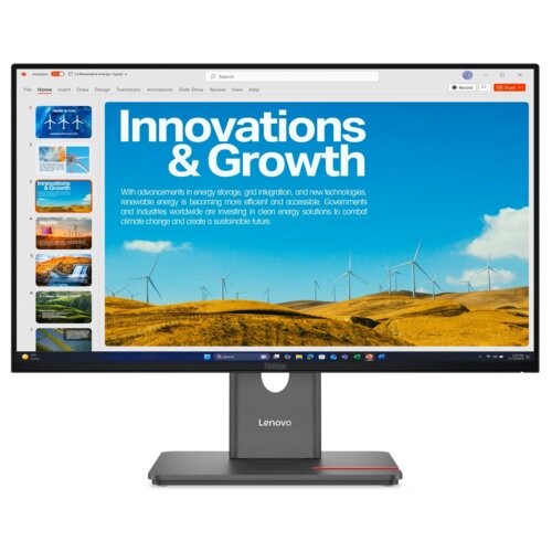 Monitor wyświetla prezentację z tytułem "Innovations & Growth" na tle krajobrazu z turbinami wiatrowymi, a poniżej znajduje się tekst o postępach w magazynowaniu energii i integracji sieci. Na obudowie monitora widoczne jest logo "Lenovo".