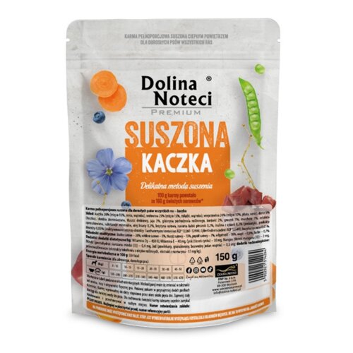 Opakowanie karmy dla psa marki Dolina Noteci Premium o smaku suszonej kaczki, z grafiką przedstawiającą warzywa i kwiaty oraz tekstem: "Delikatna metoda suszenia, 100 g karmy powstało ze 160 g świeżych surowców". Na dole opakowania znajduje się informacja