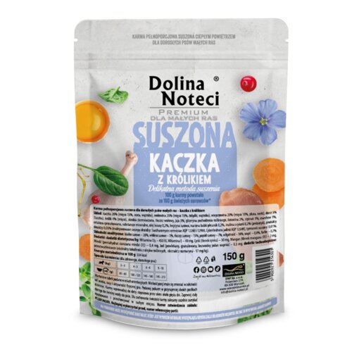 Opakowanie karmy dla psów marki Dolina Noteci Premium dla małych ras, o smaku suszonej kaczki z królikiem, o wadze 150 g. Na opakowaniu widoczne są ilustracje składników, takie jak marchewki, zioła i kwiaty, oraz szczegółowy opis składu i wartości odżywcz