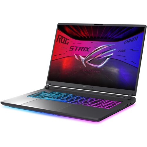 Na zdjęciu znajduje się laptop z podświetlaną klawiaturą, na ekranie widoczna jest grafika z napisem "ROG STRIX GAMER" oraz logo. Obudowa laptopa jest ciemna, a klawiatura ma wielokolorowe podświetlenie.
