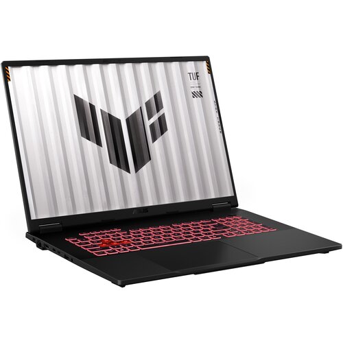 Czarny laptop z podświetlaną na czerwono klawiaturą, na ekranie widoczne jest logo w kształcie litery "V" oraz napisy "TUF" i "VISUAL TESTED". Obudowa ma matowe wykończenie, a ekran jest otwarty pod kątem.