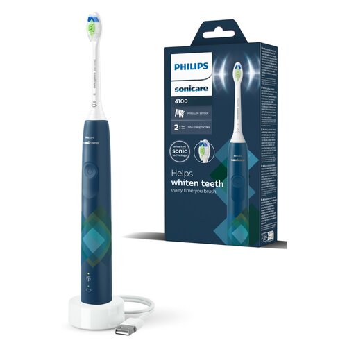 Na zdjęciu widoczna jest niebieska szczoteczka soniczna z logo "PHILIPS Sonicare" oraz opakowanie z napisem "PHILIPS Sonicare 4100" i informacjami o funkcjach, takimi jak "Pressure sensor" i "2 brushing modes". Na opakowaniu znajduje się również tekst "He