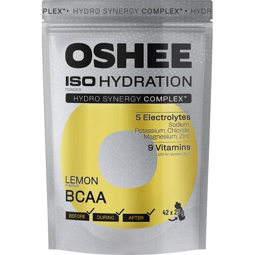 Srebrne opakowanie produktu z dużym, żółtym okręgiem, zawiera napisy: "OSHEE ISO HYDRATION", "Hydro Synergy Complex", "5 Electrolytes: Sodium, Potassium, Chloride, Magnesium, Zinc", "9 Vitamins", "Lemon Flavour BCAA", oraz "42 x 25 g". Na dole widoczne są