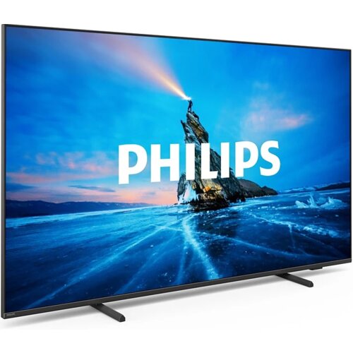 Telewizor z wyświetlaczem pokazującym krajobraz z osobą stojącą na skale nad zamarzniętym jeziorem, z napisem "PHILIPS" na środku ekranu. Obudowa telewizora jest cienka, a ekran wsparty jest na dwóch prostych nóżkach.