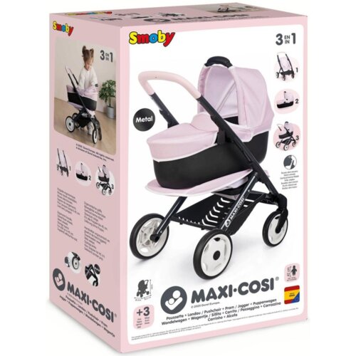 Pudełko z wózkiem dziecięcym "SMOBY Maxi-Cosi 7600253121" w kolorze różowym i czarnym, z widocznym logo "Smoby" oraz napisem "MAXI-COSI". Na opakowaniu znajdują się zdjęcia wózka w różnych konfiguracjach oraz oznaczenie "3 EN 1" i informacja "+3" wskazują