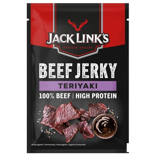 Czarna torebka z czerwonym górnym paskiem zawiera suszoną wołowinę o smaku teriyaki, z widocznym logo "Jack Link's" oraz napisami "Beef Jerky", "Teriyaki", "100% Beef | High Protein". Na dole opakowania znajdują się kawałki suszonej wołowiny i miseczka z 