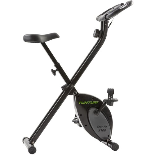 Czarny rower magnetyczny z napisem "TUNTURI Star Fit X100" na obudowie mechanizmu. Rower posiada regulowane siodełko i pedały z paskami.