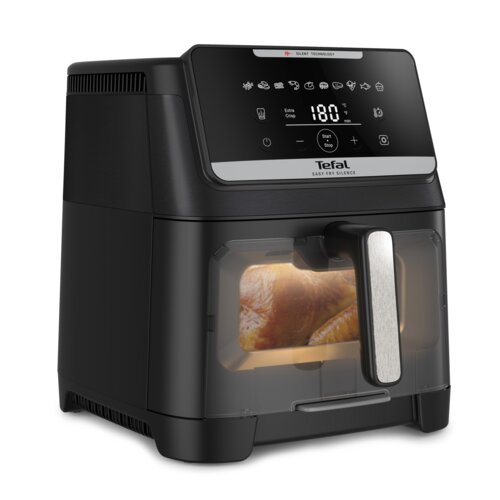 Czarna frytkownica beztłuszczowa z wyświetlaczem dotykowym pokazującym temperaturę 180°C i różne ikony programów, z widocznym logo "Tefal Easy Fry Silence". W przezroczystym okienku urządzenia widać pieczony kawałek mięsa.