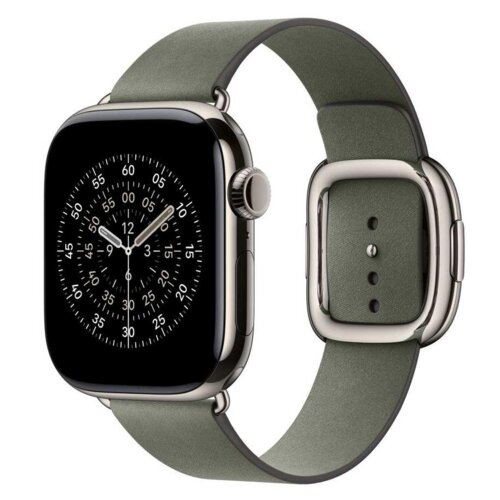 Szarozielony pasek do zegarka Apple Watch z nowoczesnym zapięciem, widoczny na tle zegarka z okrągłą tarczą i oznaczeniami godzinowymi. Pasek ma eleganckie, metalowe wykończenia i kilka otworów do regulacji długości.