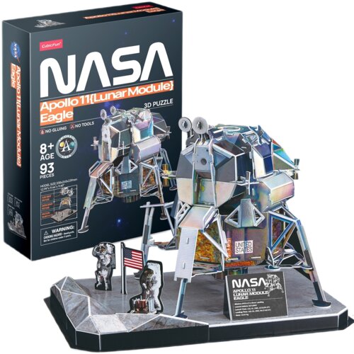 Pudełko z puzzlami 3D przedstawia moduł księżycowy Apollo 11 z napisem "NASA Apollo 11 [Lunar Module] Eagle 3D Puzzle" oraz informacjami: "8+ Age", "93 Pieces", "No Gluing", "No Tools". Obok pudełka znajduje się złożony model modułu księżycowego z flagą U