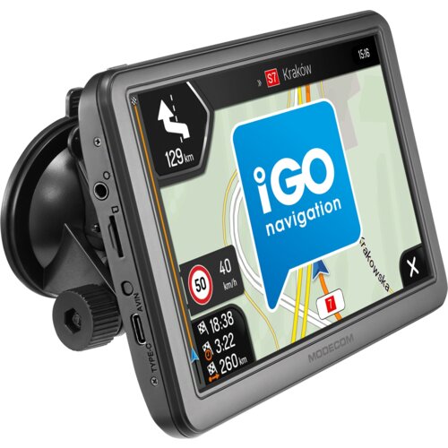 Nawigacja samochodowa z wyświetlaczem pokazującym mapę z trasą do Krakowa, logo "iGO navigation" oraz informacje o prędkości i odległości. Na obudowie widoczne są złącza oznaczone jako "TYPE-C" i "AVIN", a na dole napis "MODECOM".