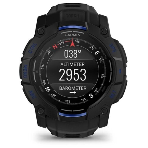Czarny smartwatch z okrągłym wyświetlaczem, na którym widoczne są wskazania kompasu, wysokościomierza (2953) oraz barometru. Na obudowie znajdują się przyciski z oznaczeniami, a na górze ekranu widnieje logo "GARMIN".