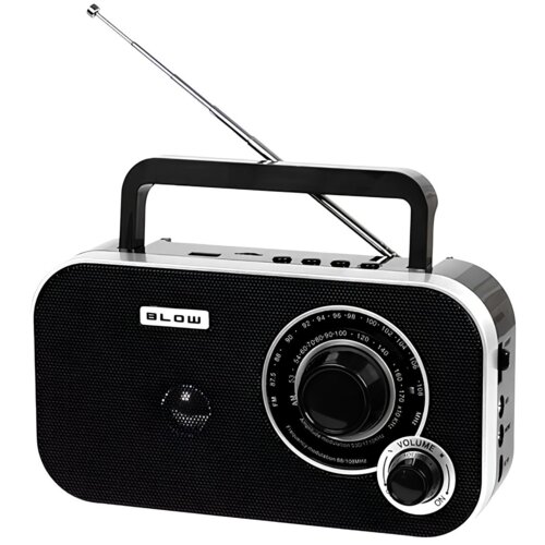 Czarno-srebrne przenośne radio z widoczną anteną, dużym pokrętłem do zmiany częstotliwości oraz mniejszym pokrętłem do regulacji głośności z napisem "VOLUME". Na przedniej części obudowy znajduje się logo "BLOW".