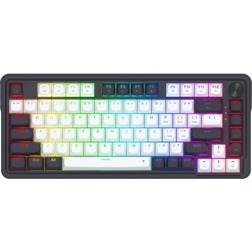 Na zdjęciu znajduje się klawiatura z podświetleniem RGB, z klawiszami w różnych kolorach, w tym białym, czarnym i czerwonym. Widoczne są klawisze funkcyjne F1-F12 oraz inne standardowe klawisze, a także pokrętło w prawym górnym rogu.