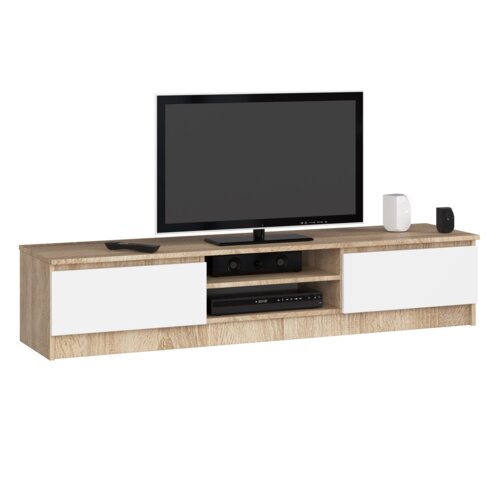 Szafka RTV w kolorze dąb sonoma z białymi, matowymi drzwiami, posiada dwie półki i jest ustawiona na niej elektronika, w tym telewizor. Produkt ma wymiary 160x40x33 cm.