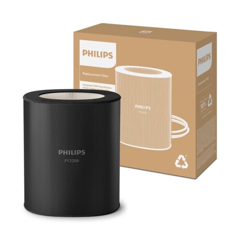 Czarny filtr do oczyszczacza powietrza z napisem "PHILIPS FY2200" stoi przed brązowym pudełkiem z białym logo "PHILIPS" i tekstem "Replacement Filter". Na pudełku widoczne są również symbole recyklingu oraz informacje o zintegrowanym filtrze HEPA NanoProt