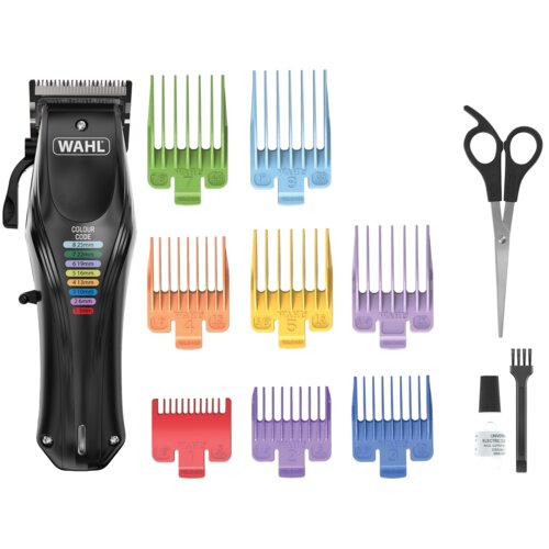Na zdjęciu znajduje się maszynka do strzyżenia z logo "WAHL" oraz zestaw kolorowych nakładek o różnych długościach, nożyczki, mała szczoteczka i buteleczka z olejem. Na maszynce widoczny jest napis "COLOUR CODE" z listą długości w milimetrach: 25mm, 22mm, 19mm, 16mm, 13mm, 10mm, 6mm, 3mm.
