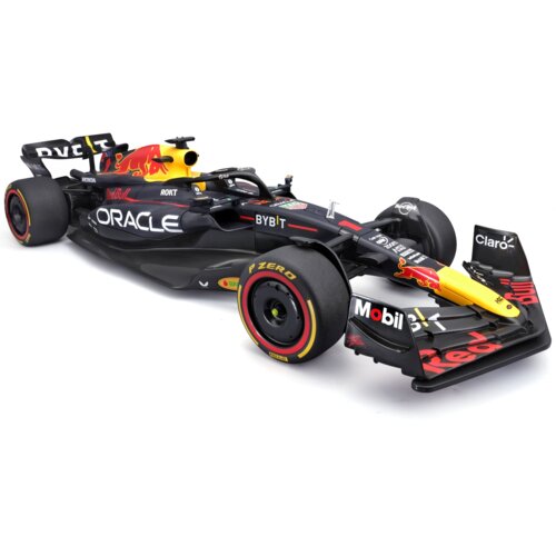 Zdalnie sterowany samochód wyścigowy w kolorach czarnym, żółtym i czerwonym z widocznymi logotypami, takimi jak "Red Bull", "Oracle", "Mobil 1" oraz "Pirelli P Zero" na oponach. Model ma szczegółowe elementy aerodynamiczne i oznaczenia sponsorów na karoserii.