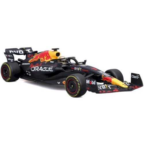 Na zdjęciu znajduje się zdalnie sterowany model samochodu wyścigowego w kolorach czarnym, czerwonym i żółtym, z widocznymi logotypami "Oracle", "Red Bull", "Honda", "Mobil", "Claro" oraz "Pirelli P Zero" na oponach. Model ma szczegółowe oznaczenia sponsorów i charakterystyczne elementy aerodynamiczne.