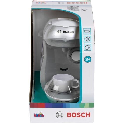 Opakowanie zabawki ekspresu do kawy z logo "BOSCH" i "TASSIMO" na przodzie urządzenia, z białą filiżanką na podstawce. Na opakowaniu widoczne są napisy "klein" oraz "BOSCH", a także oznaczenie wiekowe "3+".