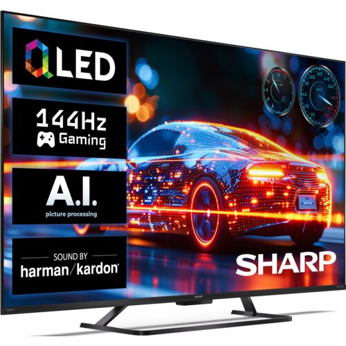 Telewizor z wyświetlaczem prezentującym kolorowy, futurystyczny samochód, z widocznymi napisami: "QLED", "144Hz Gaming", "A.I. picture processing" oraz "Sound by harman/kardon". Logo "SHARP" znajduje się w dolnym rogu ekranu.