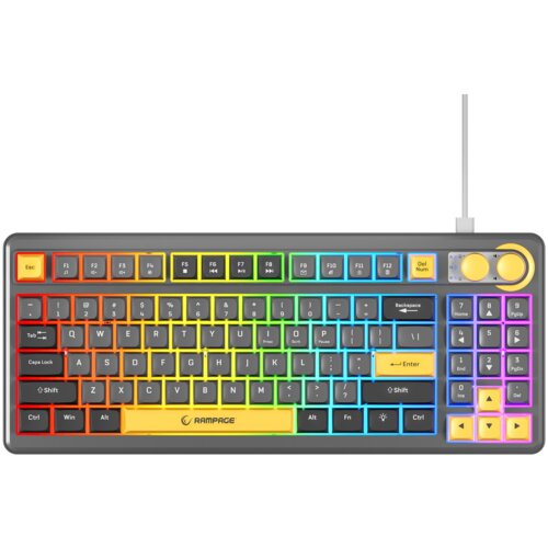Na zdjęciu znajduje się klawiatura z podświetleniem RGB, z widocznymi klawiszami funkcyjnymi od F1 do F12 oraz klawiaturą numeryczną. Na klawiaturze widoczny jest napis "RAMPAGE" oraz przyciski multimedialne i pokrętła w prawym górnym rogu.