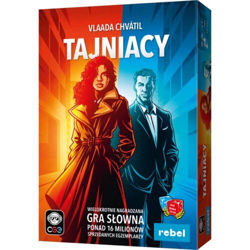 Okładka gry planszowej przedstawia dwie postacie w stylu komiksowym na tle budynków, z napisem "Vlaada Chvátil TAJNIACY" u góry. Na dole widnieje tekst: "Wielokrotnie nagradzana gra słowna, ponad 16 milionów sprzedanych egzemplarzy", oraz logo "rebel" i o