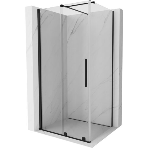 Przesuwana kabina prysznicowa o wymiarach 100 x 70 cm z transparentnym szkłem i czarnymi elementami wykończenia, umieszczona w narożniku z marmurowymi ścianami. Produkt ma prostokątny kształt i wyposażony jest w pionowy uchwyt na drzwiach.