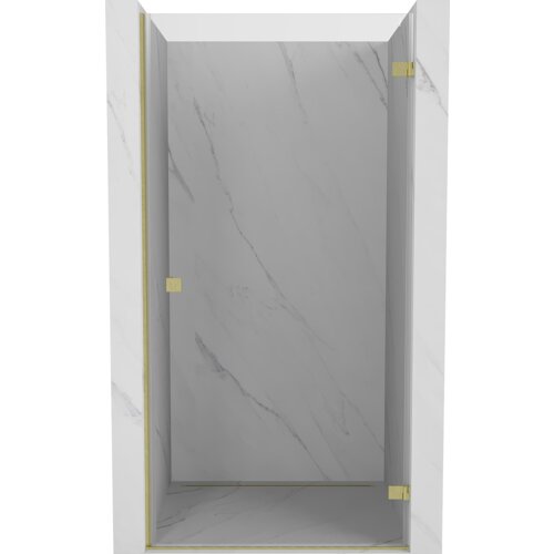 Drzwi prysznicowe uchylne o transparentnej powierzchni, z widocznymi złotymi, szczotkowanymi elementami mocującymi, zamontowane w marmurowej wnęce. Produkt ma elegancki, minimalistyczny design z subtelnymi żyłkami na powierzchni.