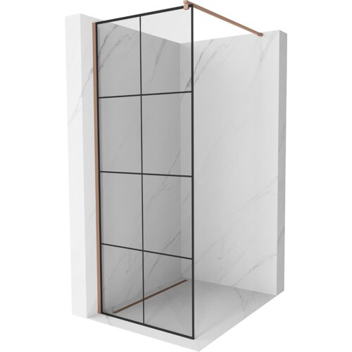 Przesłane zdjęcie przedstawia ściankę prysznicową typu walk-in o wymiarach 90 x 200 cm z czarną kratką i elementami w kolorze różowego złota, umieszczoną w narożniku wyłożonym jasnymi płytkami o marmurowym wzorze. Konstrukcja ścianki składa się z przezroczystego szkła podzielonego na prostokątne segmenty przez czarne linie.