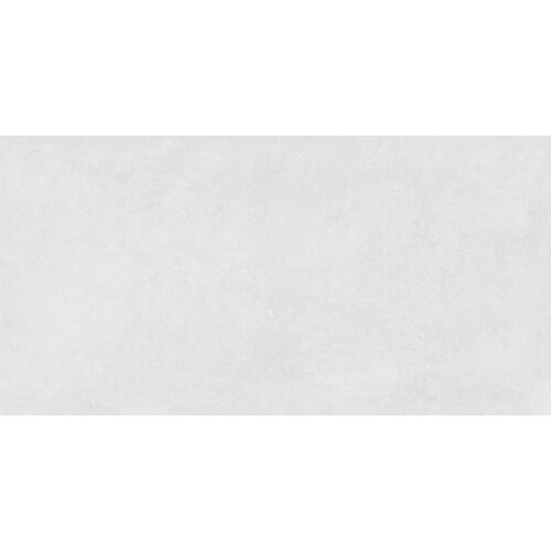 Na zdjęciu widoczna jest płytka o jednolitej, jasnoszarej powierzchni z delikatnym, matowym wykończeniem. Brak widocznych napisów lub logo.