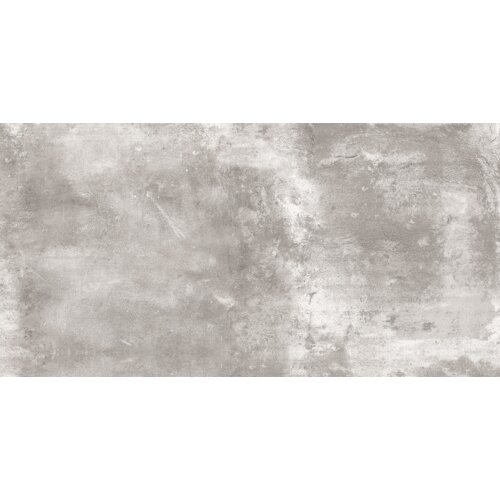 Na zdjęciu widoczna jest płytka podłogowo-ścienna o wymiarach 120 x 60 cm, w odcieniach szarości z nieregularnym wzorem przypominającym beton. Powierzchnia płytki jest gładka i szkliwiona, co nadaje jej lekki połysk.