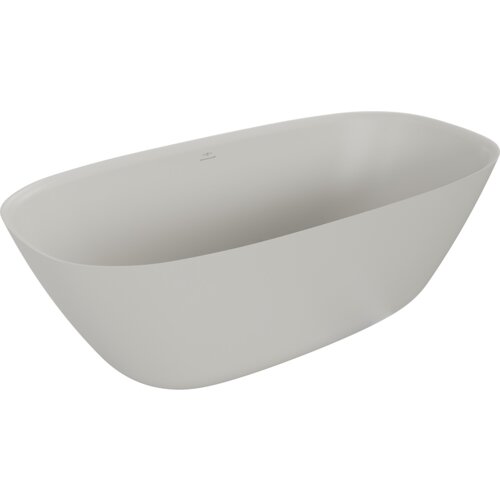 Na zdjęciu znajduje się wolnostojąca wanna o gładkiej, matowej powierzchni w kolorze betonu. Wanna ma zaokrąglone krawędzie i minimalistyczny design.