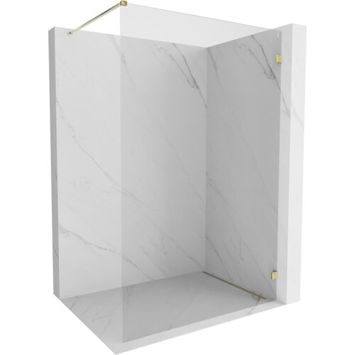Na zdjęciu znajduje się ścianka prysznicowa typu walk-in o wymiarach 150 x 200 cm, wykonana z transparentnego szkła o grubości 8 mm, z elementami w kolorze złotym. Ścianka jest umieszczona w narożniku wyłożonym płytkami imitującymi biały marmur z delikatnymi szarymi żyłkami.
