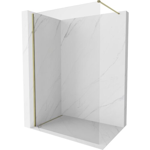 Przeszklona ścianka prysznicowa typu walk-in o wymiarach 130 x 200 cm z przezroczystego szkła o grubości 10 mm, z elementami w kolorze złotym. Ścianka jest umieszczona na tle imitującym marmur.
