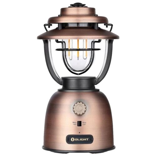 Latarka OLIGHT OL003632 Latarnia biwakowa w kolorze miedzianym z przezroczystym kloszem, widocznymi żarnikami i pokrętłem do regulacji światła z oznaczeniami "Warm Light" i "White Light". Na dolnej części znajduje się logo "OLIGHT".