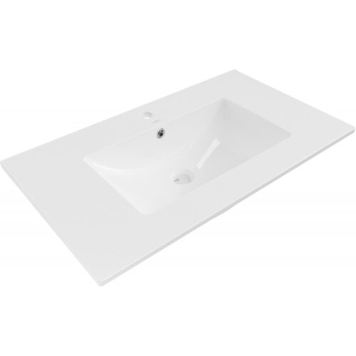 Na zdjęciu znajduje się biała umywalka wpuszczana w blat o wymiarach 80 x 46 cm. Umywalka ma prostokątny kształt z otworem na baterię i odpływ.