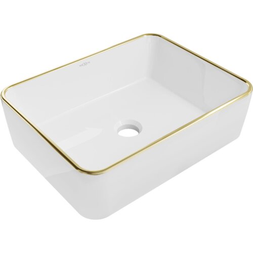 Biała umywalka nablatowa o prostokątnym kształcie z widocznym złotym rantem i otworem odpływowym na dnie. Na wewnętrznej ściance znajduje się napis "MEXEN".