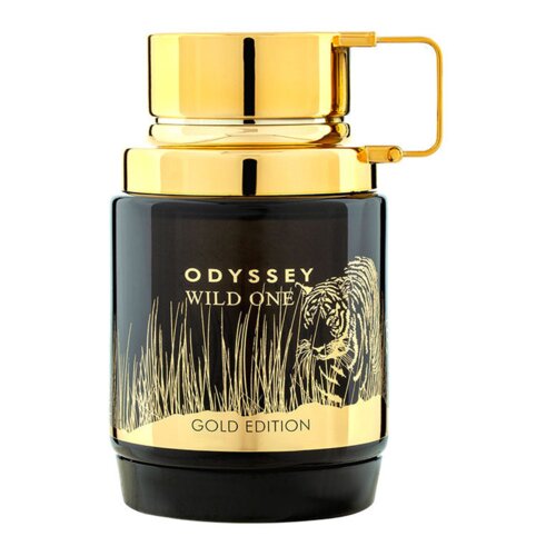 Czarny flakon perfum z złotym wieczkiem i uchwytem, ozdobiony złotym napisem "ODYSSEY WILD ONE" oraz "GOLD EDITION". Na butelce widoczny jest również złoty rysunek przedstawiający trawę i tygrysa.