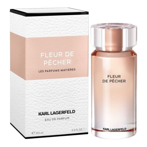Na zdjęciu widoczna jest butelka perfum oraz pudełko z napisem "Fleur de Pêcher" i "Les Parfums Matières". Na dole pudełka znajduje się napis "Karl Lagerfeld Eau de Parfum 100 ml 3.3 FL.OZ.".