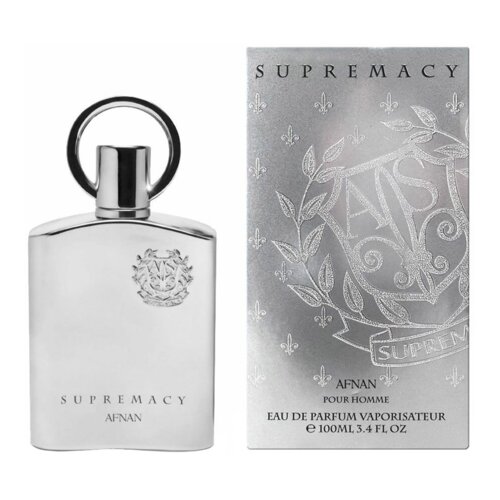 Srebrny flakon perfum z okrągłym uchwytem, obok srebrnego pudełka z napisem "SUPREMACY" oraz wzorem liści i lilii. Na flakonie widnieje napis "SUPREMACY AFNAN", a na pudełku "AFNAN POUR HOMME EAU DE PARFUM VAPORISATEUR 100ML 3.4 FL OZ".