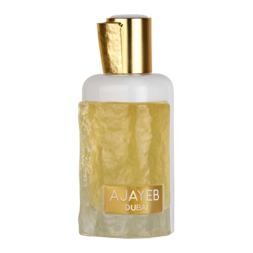 Butelka perfum o pojemności 100 ml z przezroczystego szkła, wypełniona żółtawym płynem, z białą zakrętką i złotym elementem ozdobnym. Na butelce znajduje się napis "AJAYEB DUBAI".